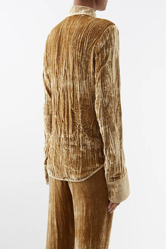 Blusa elegante de textura lisa