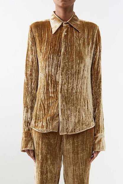 Blusa elegante de textura lisa