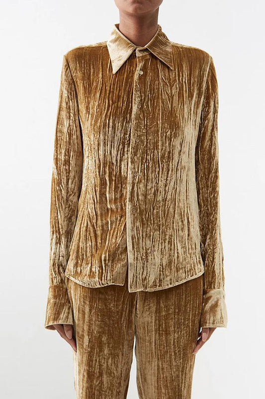 Blusa elegante de textura lisa